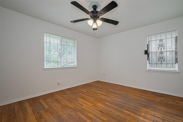 1029 Dolly Wright St, Houston, TX 77088 - unfurnished room with baseboards, wood finished floors, and ceiling fan