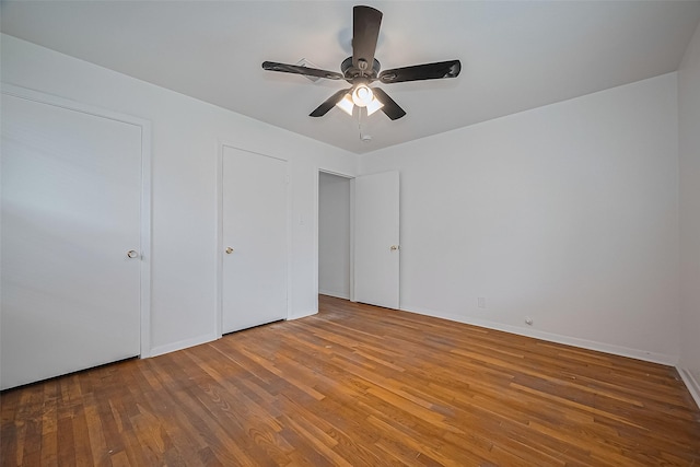 1029 Dolly Wright St, Houston, TX 77088 - unfurnished bedroom featuring wood finished floors, a ceiling fan, and baseboards
