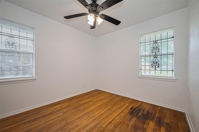 1029 Dolly Wright St, Houston, TX 77088 - empty room featuring plenty of natural light, hardwood / wood-style floors, and baseboards