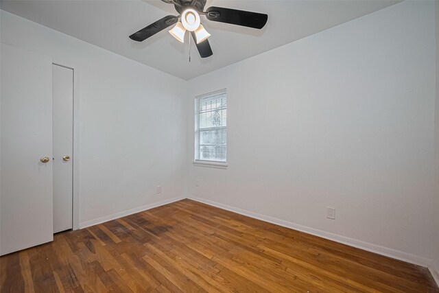 1029 Dolly Wright St, Houston, TX 77088 - spare room featuring wood finished floors, a ceiling fan, and baseboards