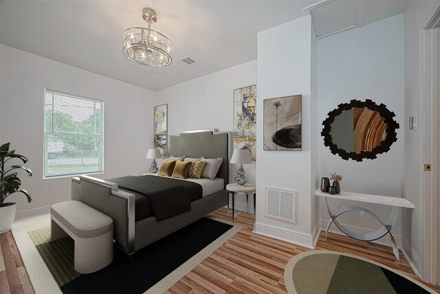 1029 Dolly Wright St, Houston, TX 77088 - bedroom featuring light wood-style floors, baseboards, and a chandelier