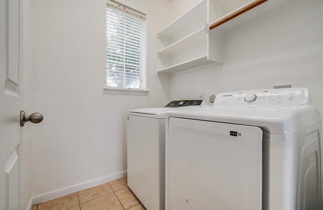 6018 Lamb Crk, Missouri City, TX 77459 - washroom featuring washer and dryer, baseboards, and light tile patterned floors