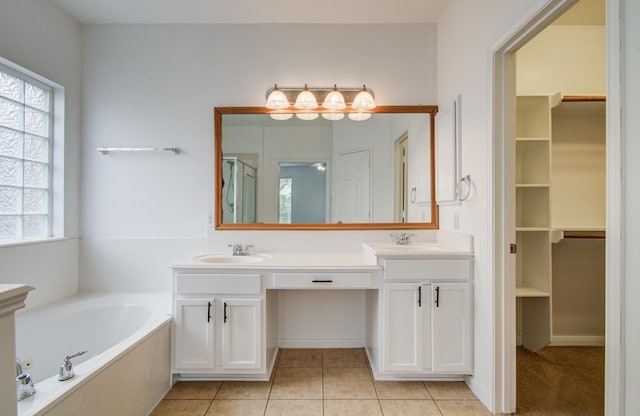 6018 Lamb Crk, Missouri City, TX 77459 - full bathroom with double vanity, a garden tub, tile patterned flooring, a walk in closet, and a shower with shower door