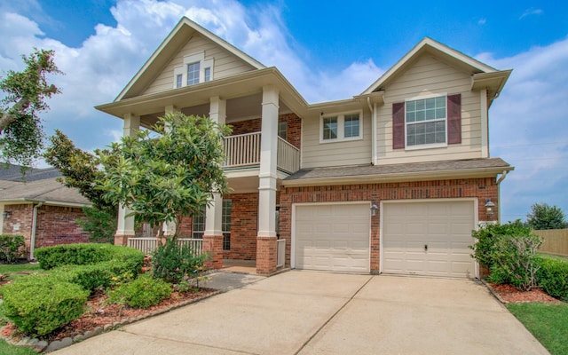 6018 Lamb Crk, Missouri City, TX 77459 - view of front of home with covered porch, brick siding, concrete driveway, a balcony, and an attached garage