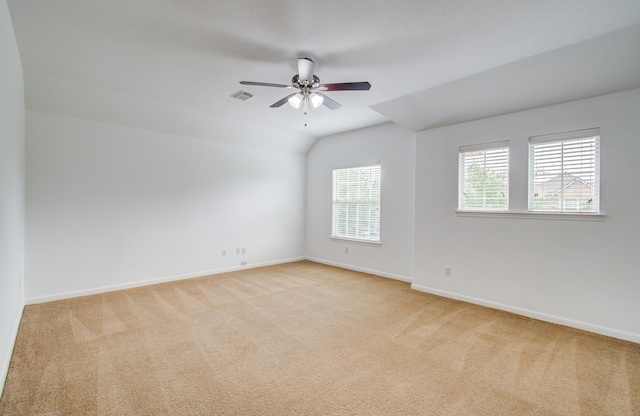 6018 Lamb Crk, Missouri City, TX 77459 - spare room featuring light carpet, vaulted ceiling, ceiling fan, and baseboards