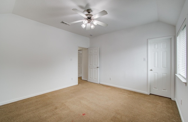 6018 Lamb Crk, Missouri City, TX 77459 - spare room featuring light carpet, vaulted ceiling, a ceiling fan, and baseboards