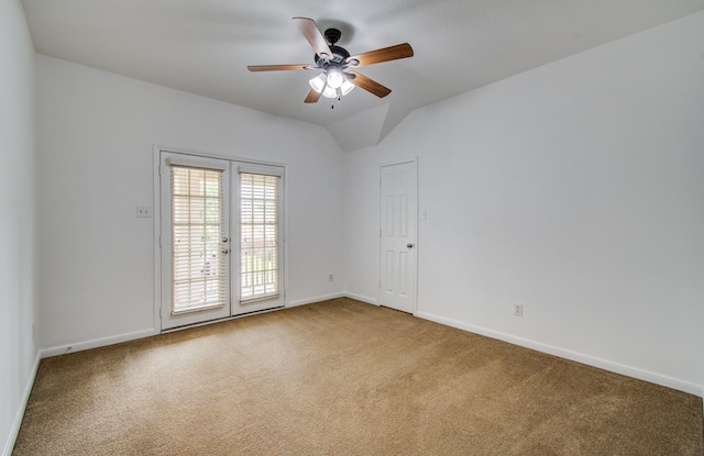 6018 Lamb Crk, Missouri City, TX 77459 - carpeted spare room featuring baseboards, ceiling fan, vaulted ceiling, and french doors