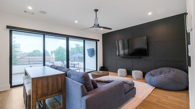 1410 Indiana St, Houston, TX 77006 - living room featuring light wood-type flooring, ceiling fan, recessed lighting, and an accent wall