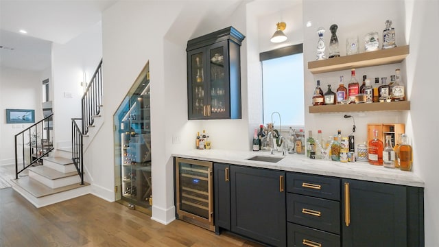 1410 Indiana St, Houston, TX 77006 - indoor wet bar with beverage cooler, dark wood finished floors, stairway, and baseboards