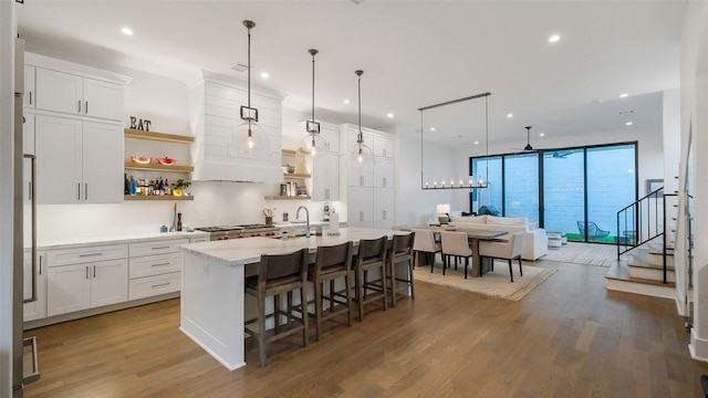1410 Indiana St, Houston, TX 77006 - kitchen with open shelves, dark wood-style flooring, white cabinets, recessed lighting, and decorative backsplash