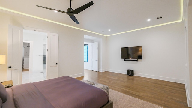 1410 Indiana St, Houston, TX 77006 - bedroom with wood finished floors, baseboards, recessed lighting, and a ceiling fan