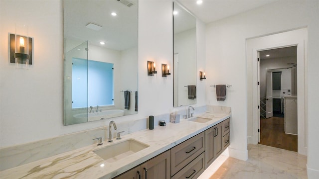 1410 Indiana St, Houston, TX 77006 - bathroom with marble tiled flooring, double vanity, and recessed lighting
