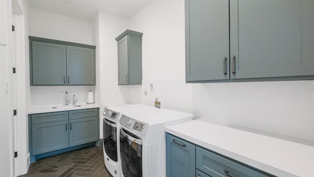 1410 Indiana St, Houston, TX 77006 - laundry room featuring cabinet space, washer and dryer, brick patterned floors, and wet bar