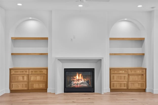 1732 Libbey Dr, Houston, TX 77018 - detailed view of wood finished floors, a glass covered fireplace, ceiling fan, and recessed lighting