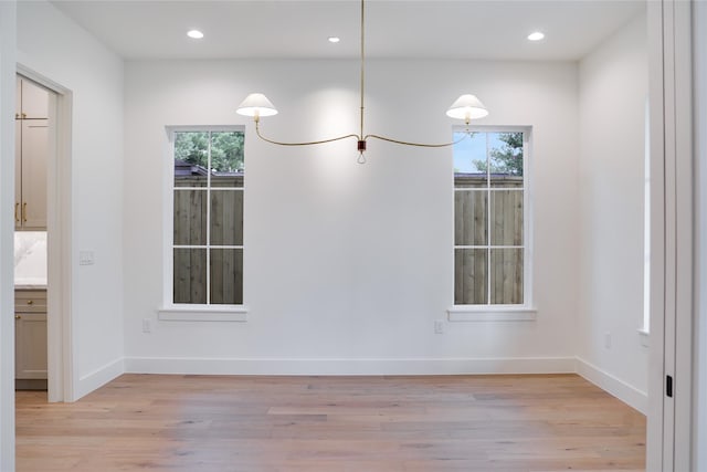 1732 Libbey Dr, Houston, TX 77018 - unfurnished dining area featuring healthy amount of natural light, light wood finished floors, recessed lighting, and baseboards