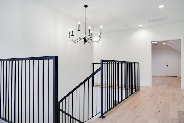 1732 Libbey Dr, Houston, TX 77018 - staircase featuring attic access, wood finished floors, recessed lighting, a chandelier, and baseboards
