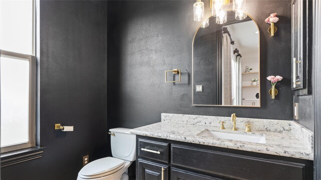 1415 W 21st St Unit A, Houston, TX 77008 - bathroom featuring toilet, a textured wall, and vanity