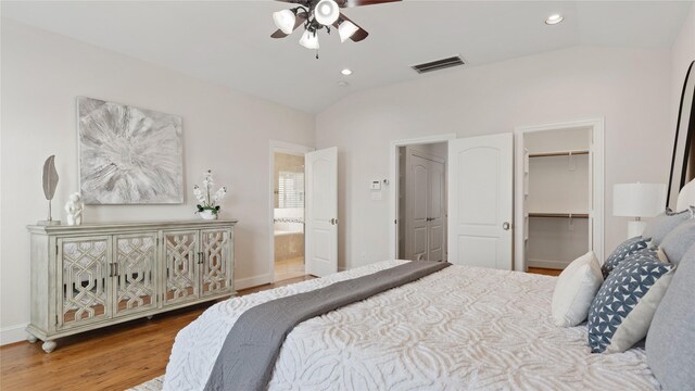 1415 W 21st St Unit A, Houston, TX 77008 - bedroom featuring vaulted ceiling, wood finished floors, a spacious closet, recessed lighting, and connected bathroom