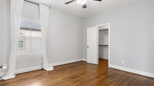 1415 W 21st St Unit A, Houston, TX 77008 - unfurnished bedroom with wood finished floors, baseboards, a walk in closet, and a closet
