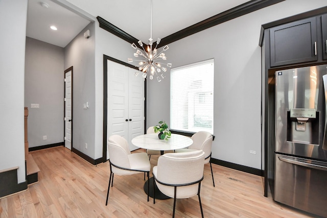 1544 W 23rd St Unit B, Houston, TX 77008 - dining area with light wood-style floors, baseboards, and a chandelier
