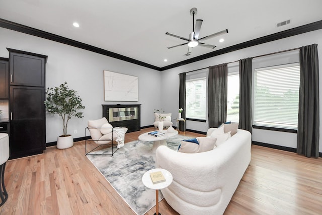 1544 W 23rd St Unit B, Houston, TX 77008 - living room with crown molding, baseboards, a ceiling fan, light wood-style floors, and recessed lighting