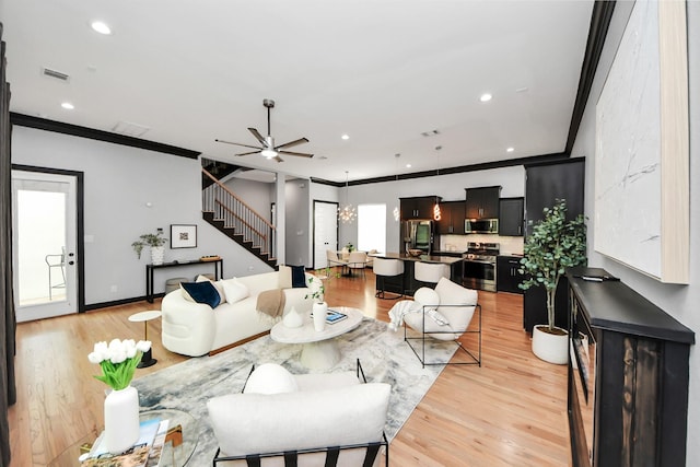 1544 W 23rd St Unit B, Houston, TX 77008 - living area with stairway, ornamental molding, light wood finished floors, a ceiling fan, and recessed lighting