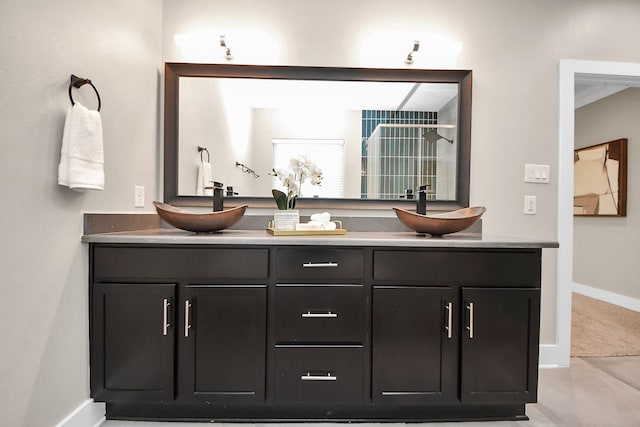 1544 W 23rd St Unit B, Houston, TX 77008 - full bathroom with double vanity, baseboards, and a shower