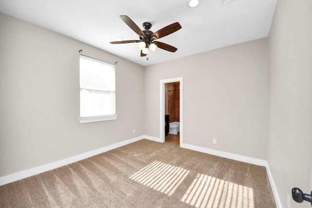 1544 W 23rd St Unit B, Houston, TX 77008 - carpeted spare room featuring baseboards and ceiling fan