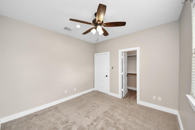 1544 W 23rd St Unit B, Houston, TX 77008 - unfurnished bedroom with carpet flooring, baseboards, a walk in closet, ceiling fan, and a closet