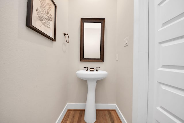 1544 W 23rd St Unit B, Houston, TX 77008 - bathroom with baseboards and wood finished floors