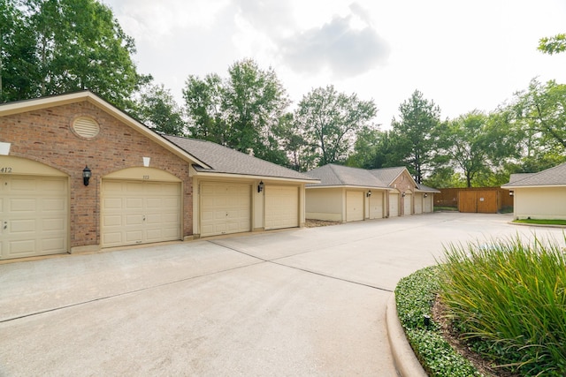 6607 Lake Woodlands Dr Unit 312, The Woodlands, TX 77382 - view of front of property with community garages and brick siding