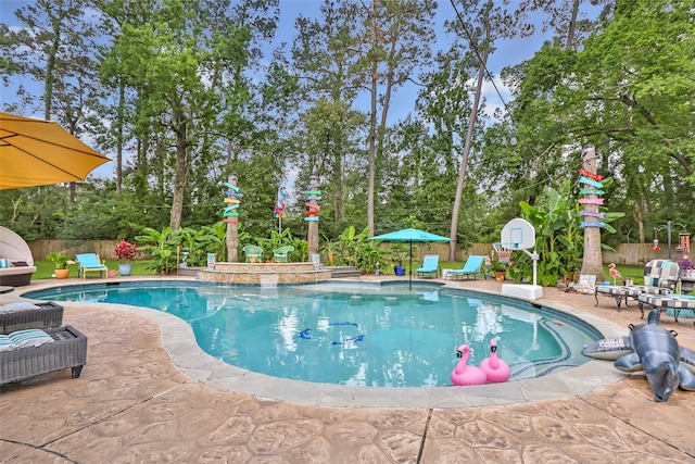 1310 Hickory Ln, Houston, TX 77339 - view of pool featuring a patio, a fenced backyard, and view of wooded area