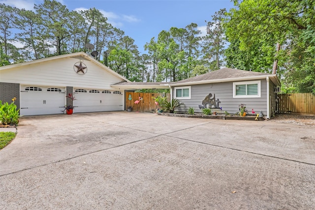 1310 Hickory Ln, Houston, TX 77339 - view of front of property featuring concrete driveway, an attached garage, and a shingled roof