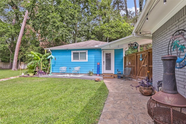 1310 Hickory Ln, Houston, TX 77339 - view of front facade featuring a patio and roof with shingles