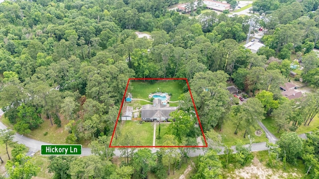 1310 Hickory Ln, Houston, TX 77339 - aerial overview of property's location featuring property parcel outlined and a forest