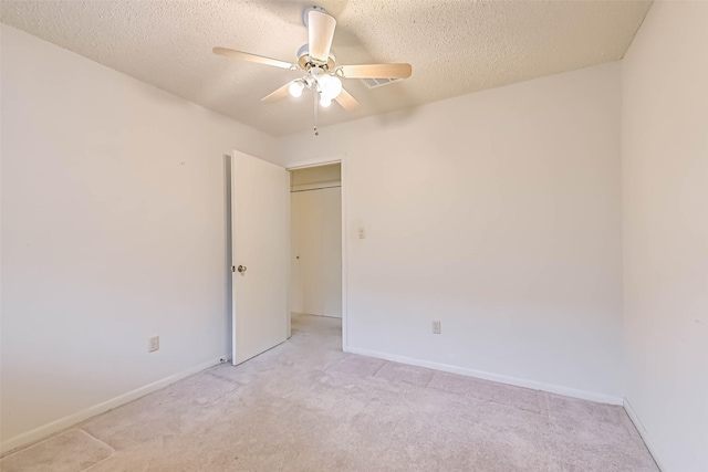 15419 Diana Ln, Houston, TX 77062 - spare room with a ceiling fan, light colored carpet, a textured ceiling, and baseboards