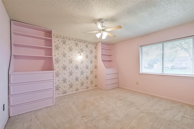 15419 Diana Ln, Houston, TX 77062 - unfurnished bedroom featuring carpet floors, a textured ceiling, baseboards, and ceiling fan