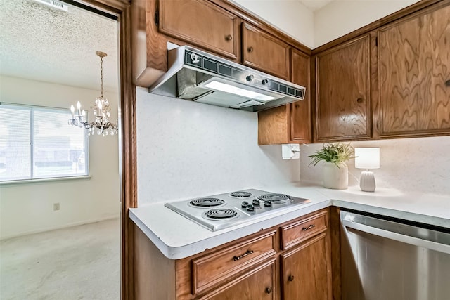 15419 Diana Ln, Houston, TX 77062 - kitchen featuring appliances with stainless steel finishes, under cabinet range hood, light countertops, a chandelier, and brown cabinets