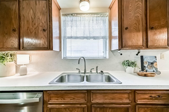 15419 Diana Ln, Houston, TX 77062 - kitchen with a sink, dishwasher, light countertops, and brown cabinets