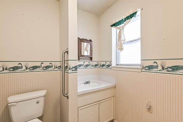 15419 Diana Ln, Houston, TX 77062 - bathroom featuring wainscoting, toilet, and vanity