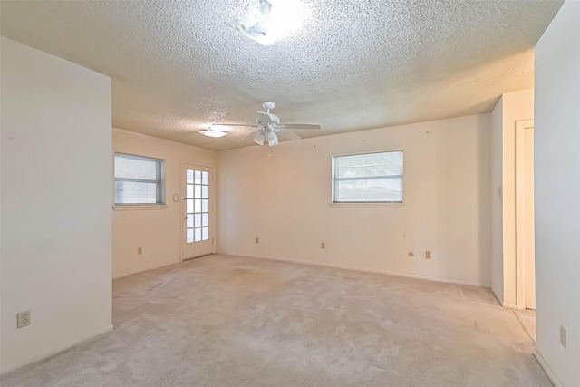 15419 Diana Ln, Houston, TX 77062 - empty room featuring a textured ceiling, light colored carpet, and a ceiling fan