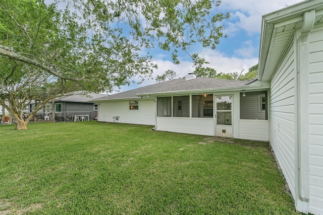 15419 Diana Ln, Houston, TX 77062 - back of house with a shingled roof and a sunroom
