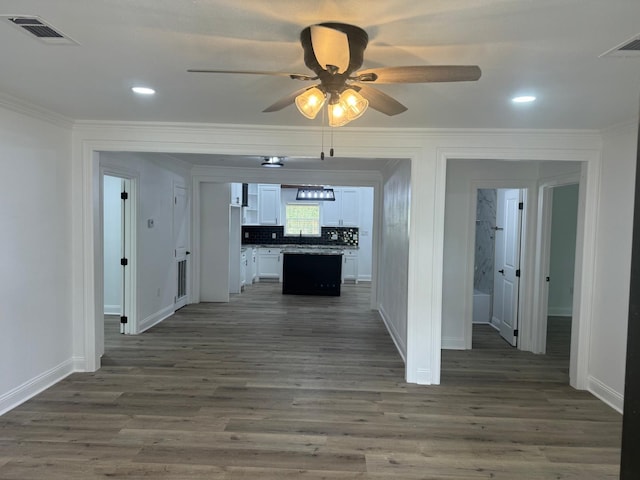 4120 Buffalo St, Beaumont, TX 77703 - hallway with crown molding, baseboards, dark wood-type flooring, and recessed lighting