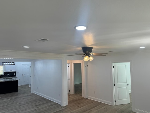 4120 Buffalo St, Beaumont, TX 77703 - spare room with ceiling fan, crown molding, wood finished floors, baseboards, and recessed lighting