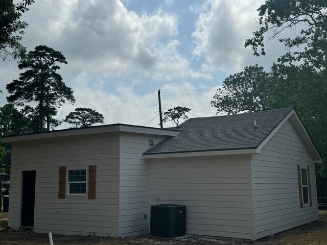 4120 Buffalo St, Beaumont, TX 77703 - view of home's exterior featuring central air condition unit and roof with shingles