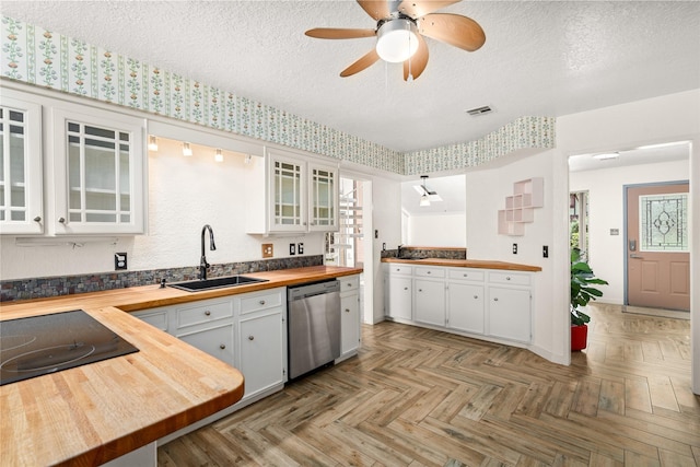 707 Center Hill Dr, Houston, TX 77079 - kitchen featuring wood counters, stainless steel dishwasher, a sink, white cabinets, and ceiling fan