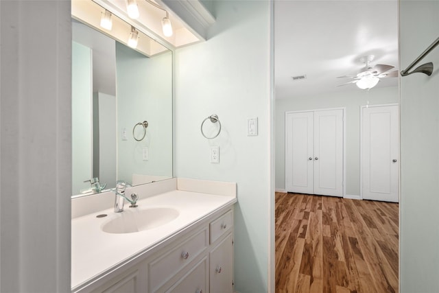 707 Center Hill Dr, Houston, TX 77079 - bathroom featuring wood finished floors, ceiling fan, and vanity
