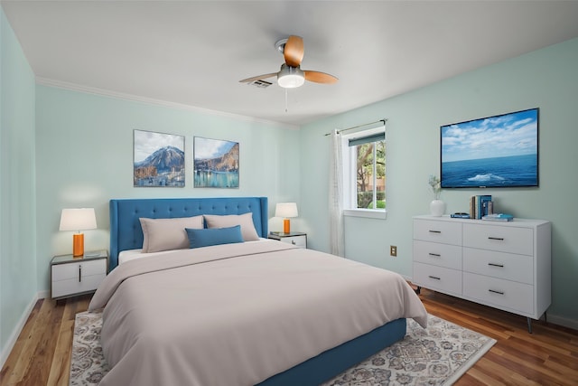 707 Center Hill Dr, Houston, TX 77079 - bedroom featuring wood finished floors, a ceiling fan, baseboards, and ornamental molding