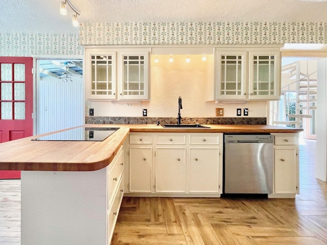 707 Center Hill Dr, Houston, TX 77079 - kitchen featuring dishwasher, wooden counters, a sink, black electric cooktop, and wallpapered walls