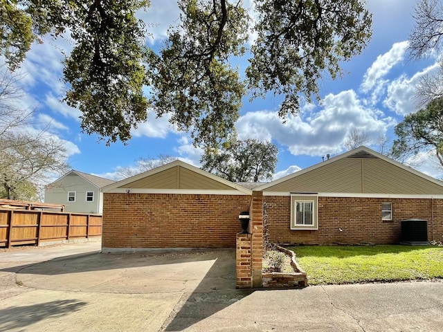 707 Center Hill Dr, Houston, TX 77079 - view of side of property with a central AC unit and brick siding